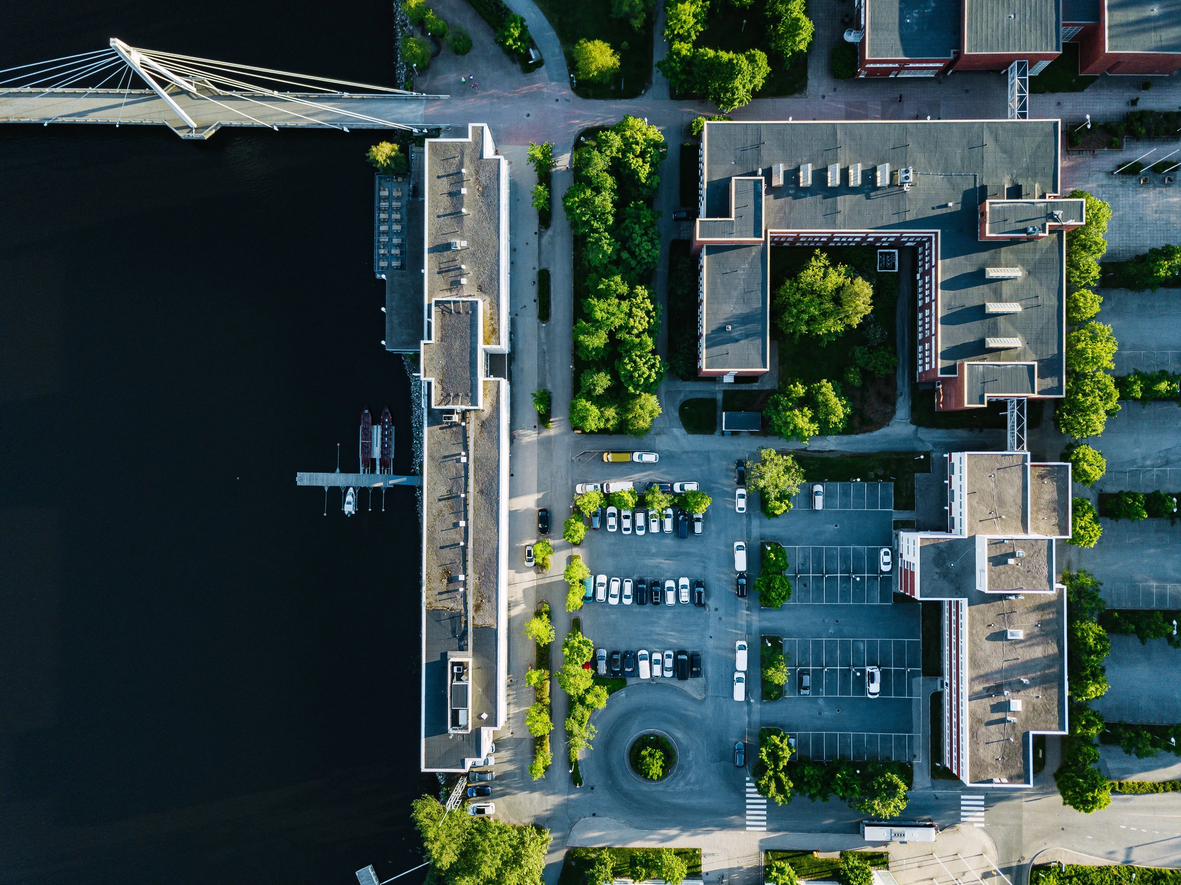 Urban Design — aerial view of city buildings with car parking un utc