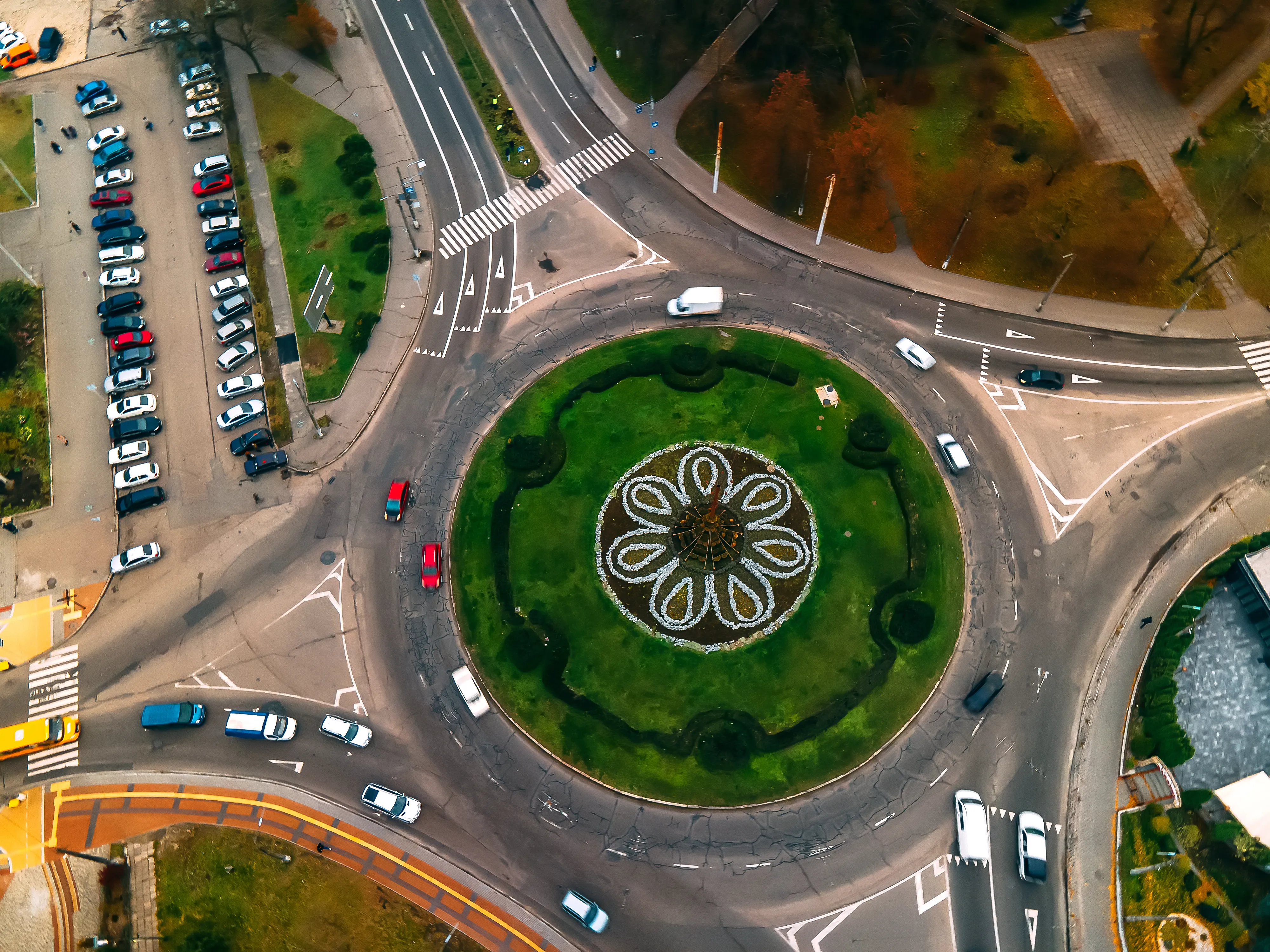 Urban Design — aerial view of roundabout road with circular cars utc