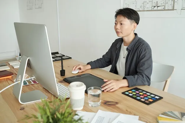 A Wolf San Savino designer resolving a scheme in 3D, with working drawings pinned behind